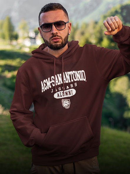 A man is wearing an A&M University-San Antonio Jaguars hoodie of alumni design