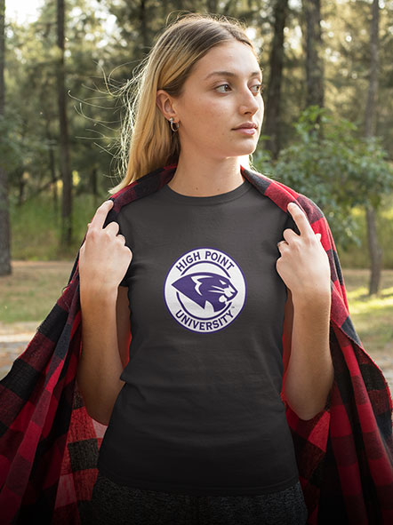 A girl is wearing a High Point University Panthers t-shirt of cinder design