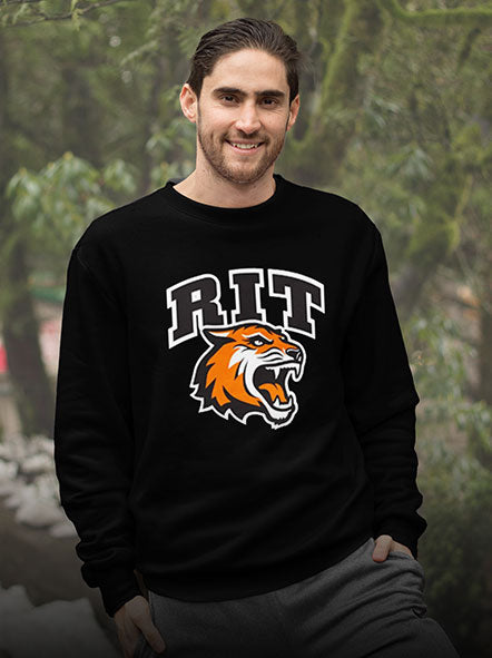 A man is wearing a Rochester Institute of Technology College sweatshirt of a college design