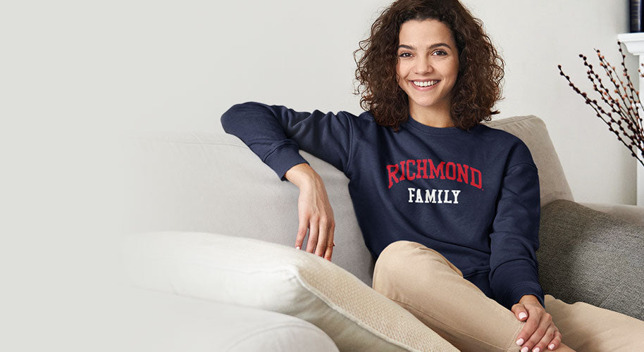 A girl is wearing University of Richmond Spiders Family sweatshirt