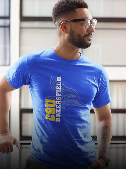 A man is wearing a CSU Bakersfield t-shirt of ghost design