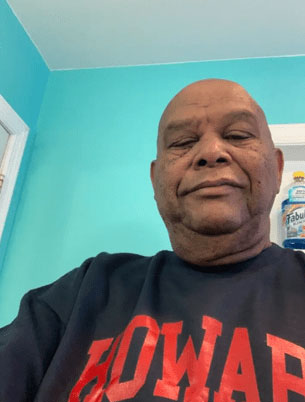 Customer Review: A bald African American man wearing a Howard University sweatshirt