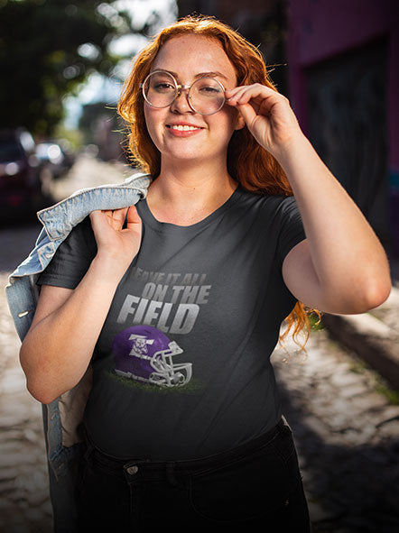 A girl is wearing a University of Central Oklahoma Bronchos t-shirt of Gridiron design