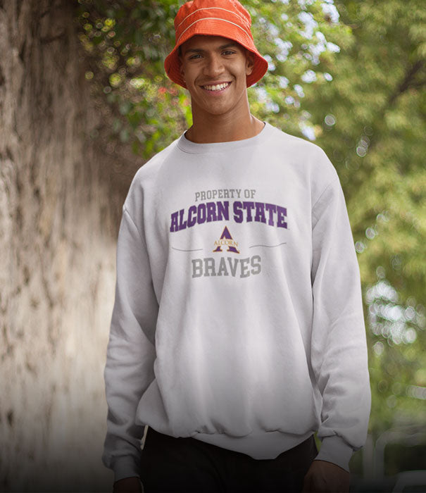 A guy is wearing an Alcorn State University Braves sweatshirt
