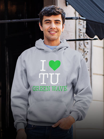 A guy is wearing a Tulane University Green Waves hoodie of i love design