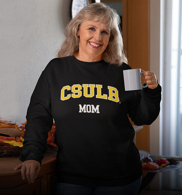 A woman is wearing California State University Long Beach sweatshirt with word MOM
