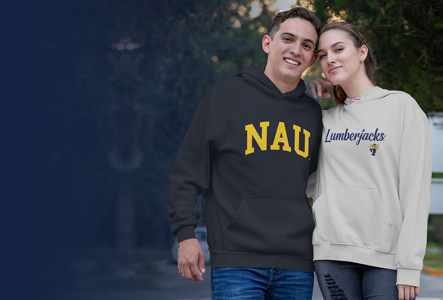 A guy and girl wearing Northern Arizona University Lumberjacks unisex hoodies