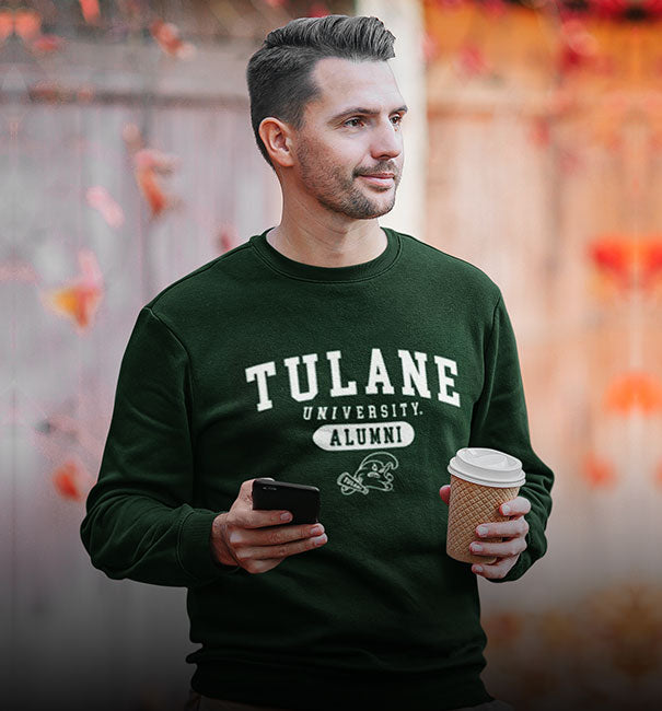 A man is wearing Tulane university alumni sweatshirt