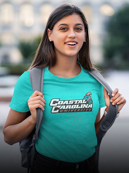A girl is wearing a Coastal Carolina University Chanticleers t-shirt of basketball design