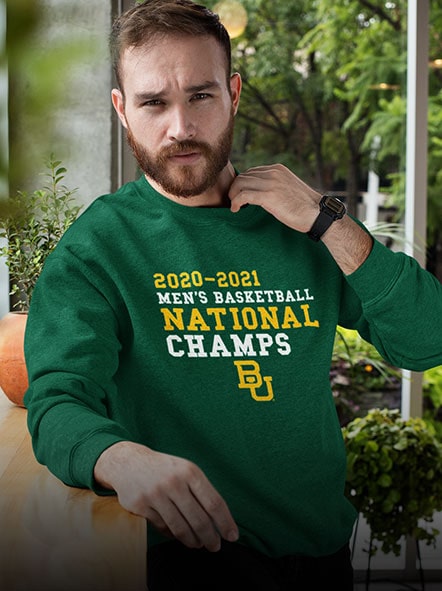 A man is wearing a Baylor University Bears sweatshirt of champions design