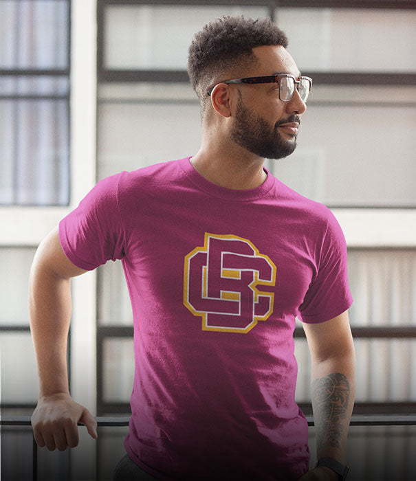 A black man is wearing a Bethune-Cookman University Wildcats t-shirt