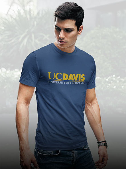 A man is wearing a UC DAVIS university t-shirt of Script design
